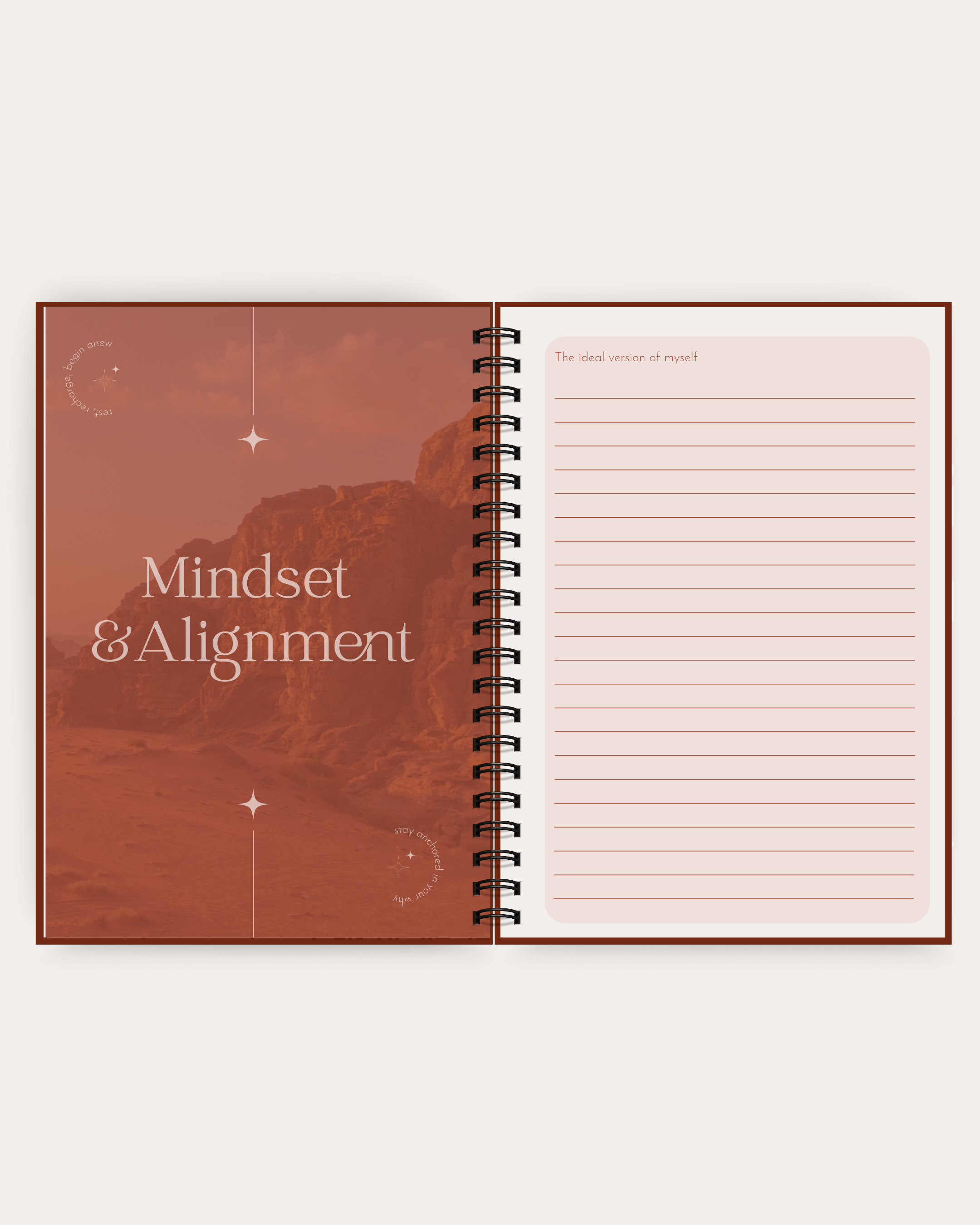Open spiral-bound notebook with 'Mindset & Alignment' on a red cover and lined pages.