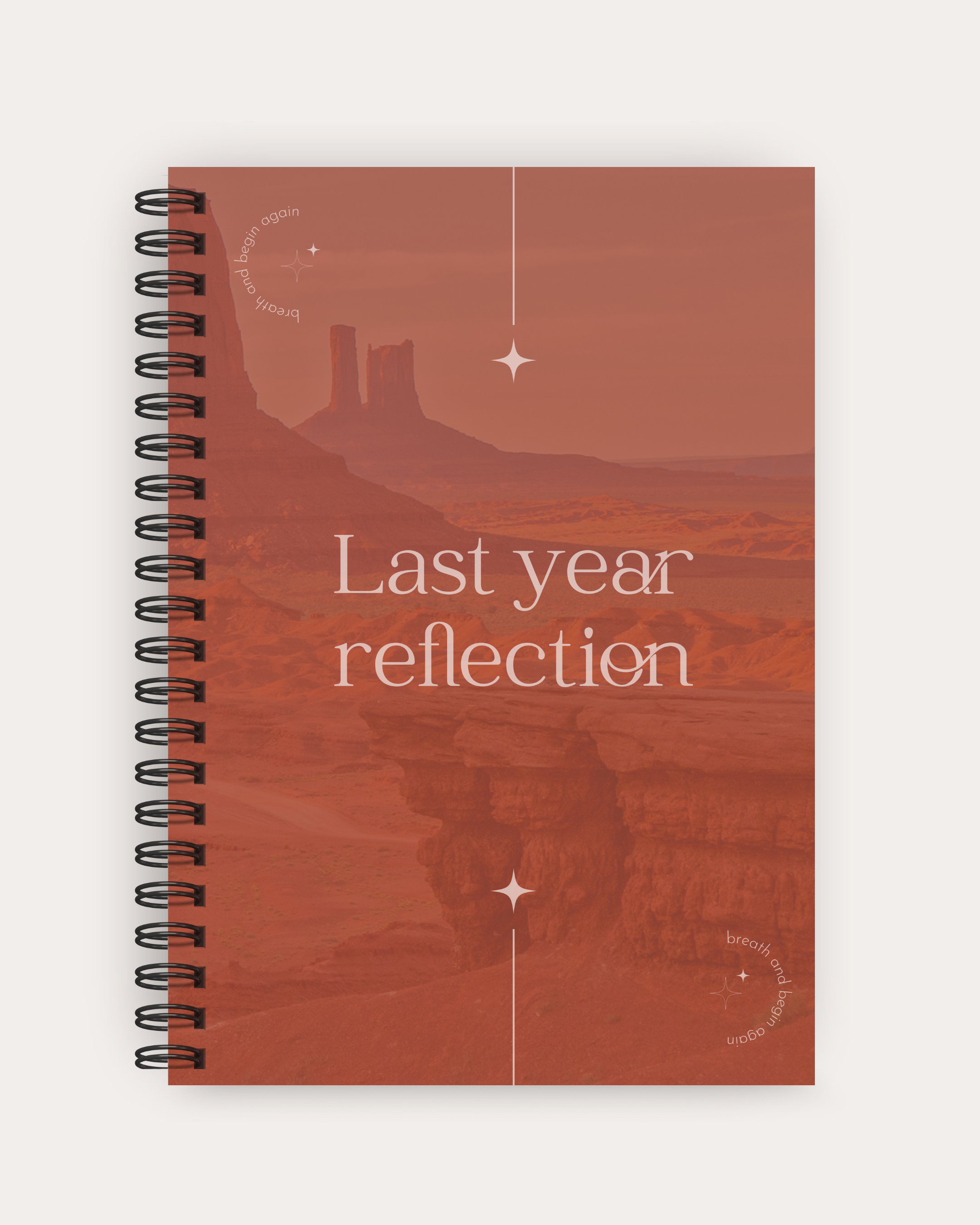 Notebook with a desert landscape design and 'Last year reflection' text on a white background
