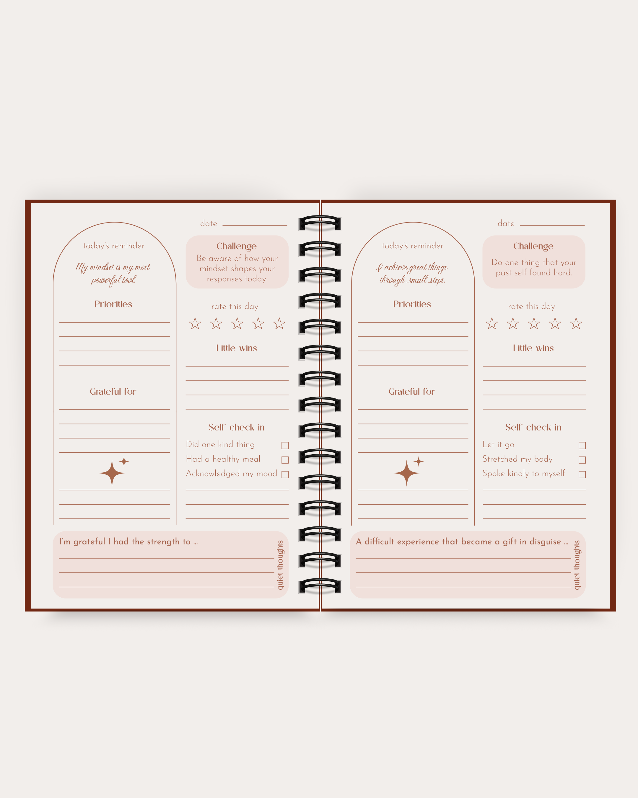 Open spiral-bound planner with daily journaling pages on a white background