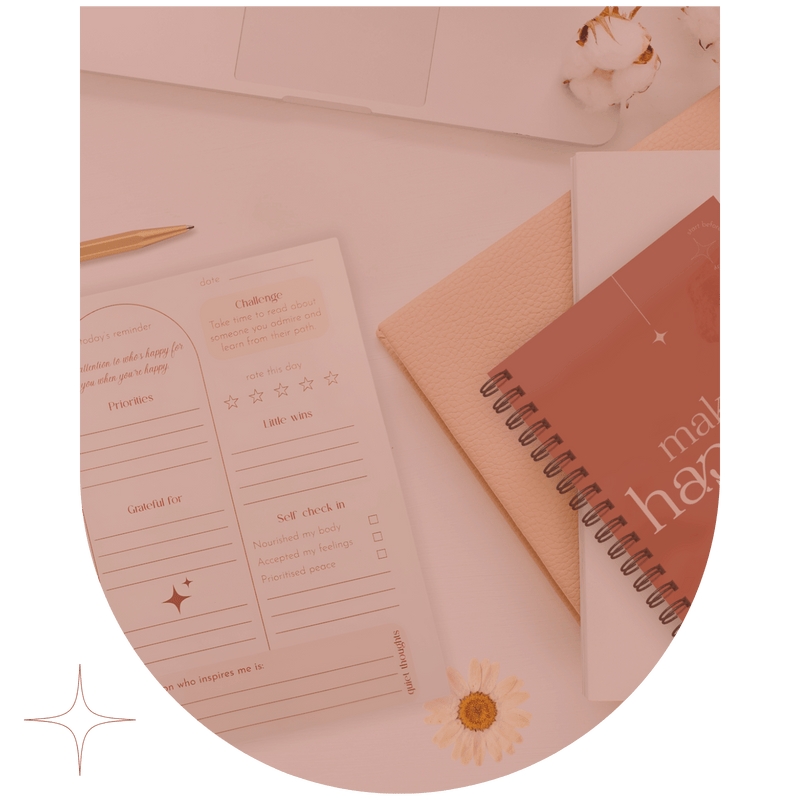 open agenda on desk near other books