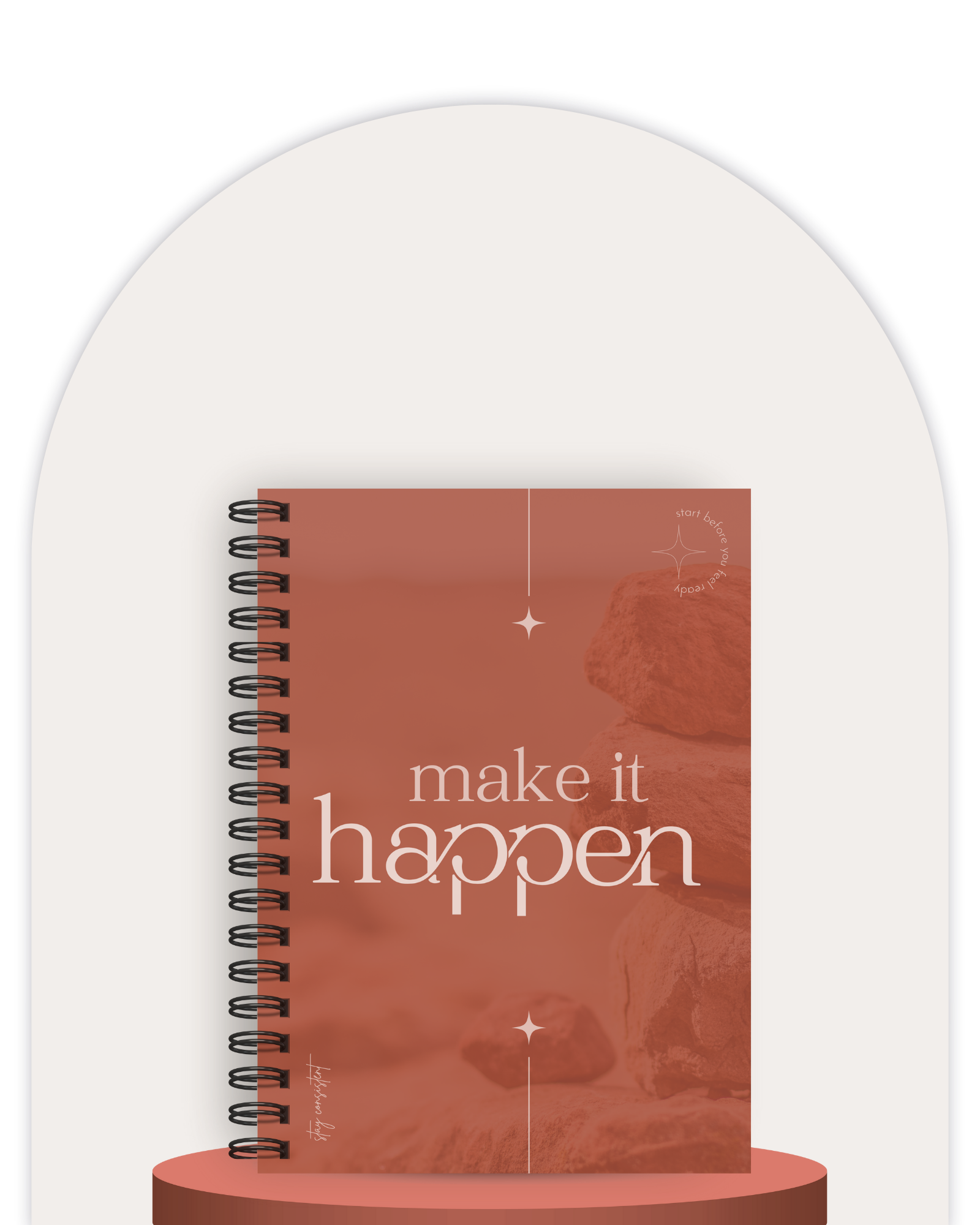 Notebook with 'make it happen' text on a white background