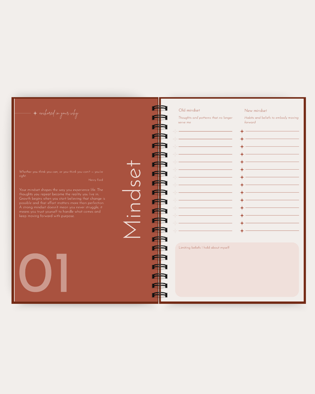 An open spiral-bound planner or notebook with a terracotta-colored left page and a white right page with lined writing sections and the word 'Mindset' printed vertically.