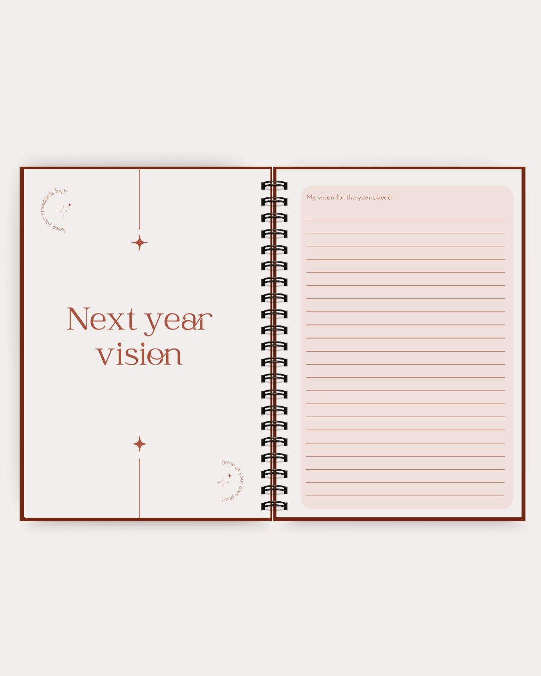 An open spiral-bound notebook with a minimalist design, featuring a left page titled 'Next year vision' in brown text and a lined right page for writing, set against a light beige background.