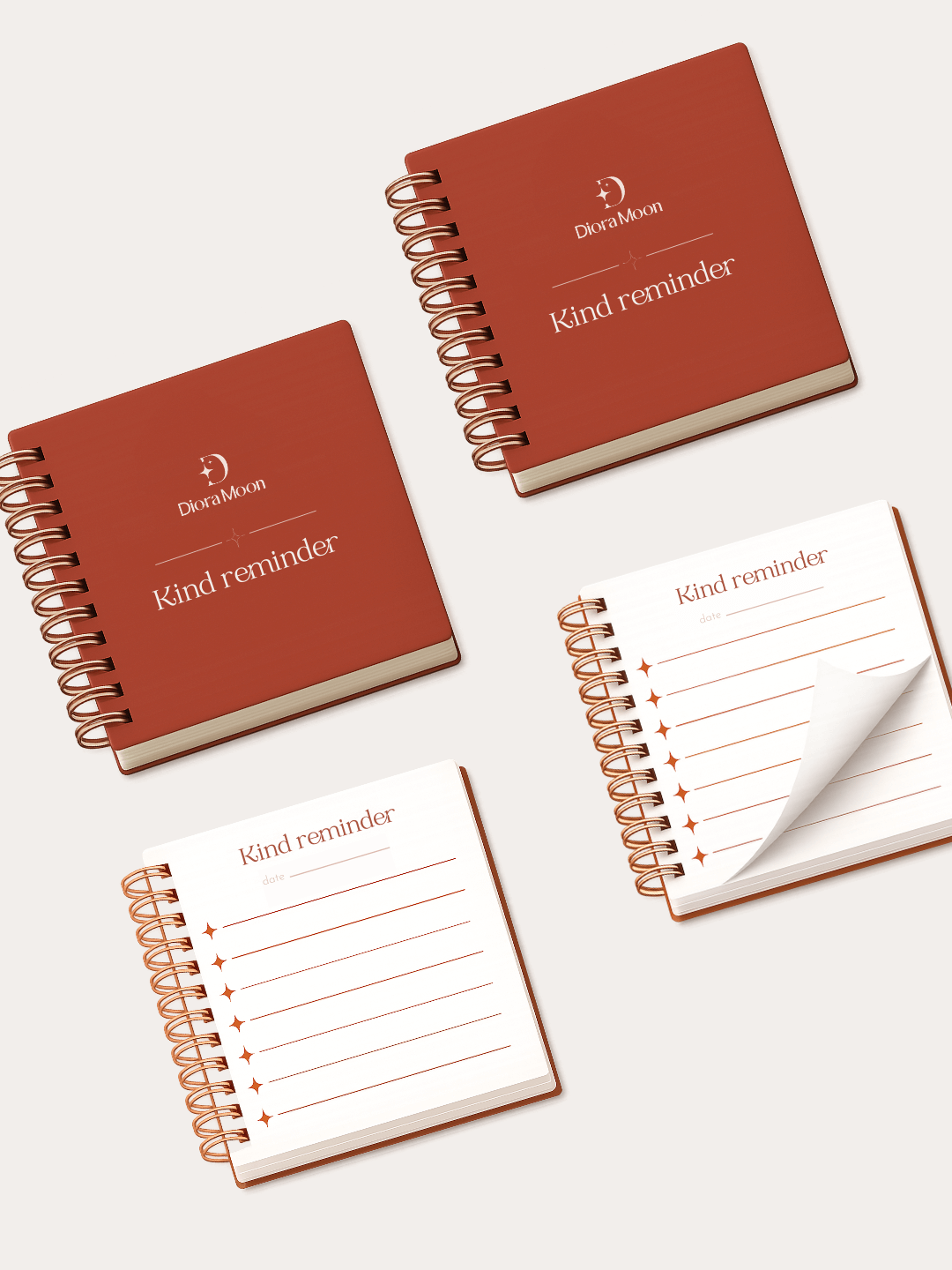Terracotta spiral-bound notebooks with 'Kind reminder' text on a white background