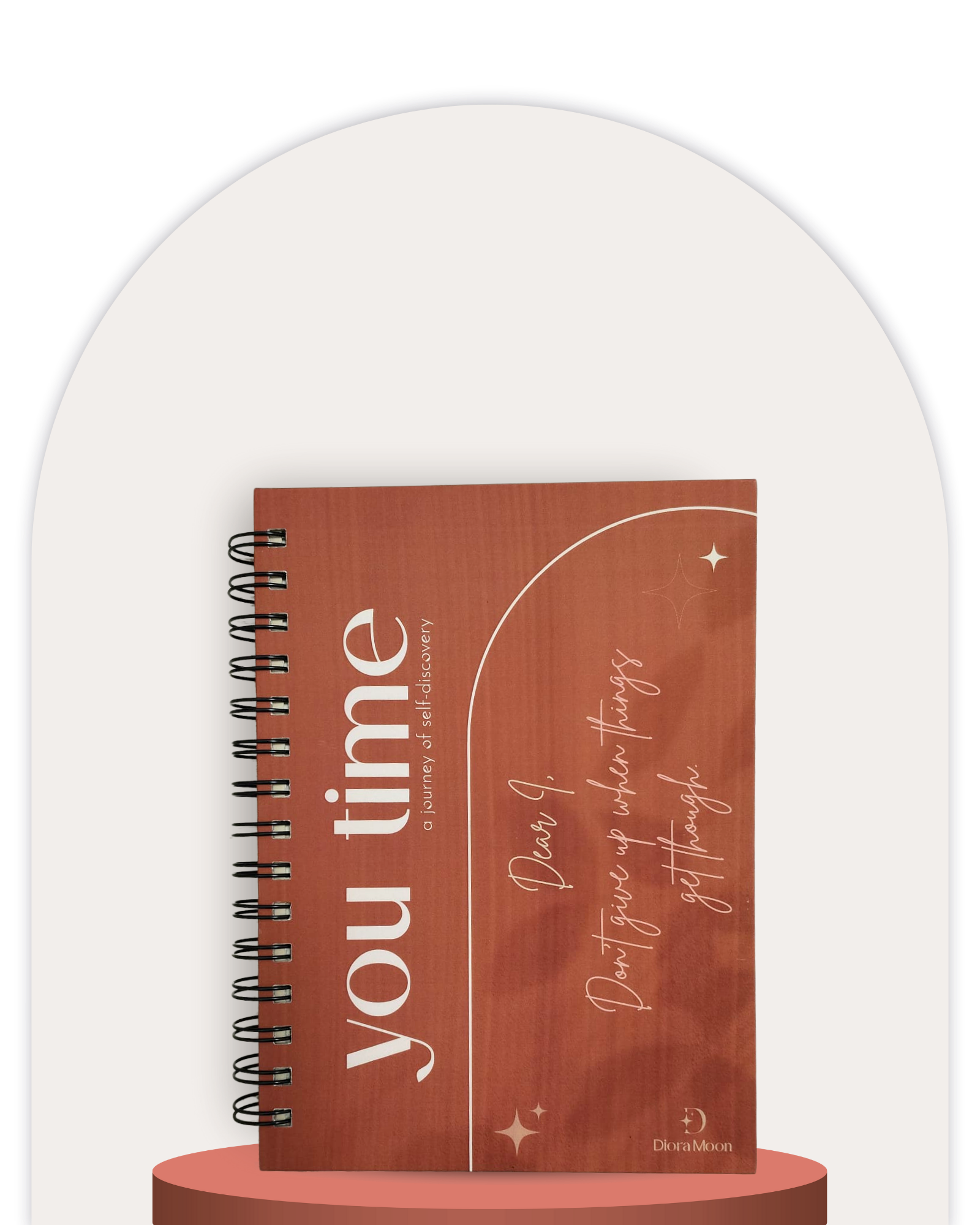 Notebook with motivational text on a white background