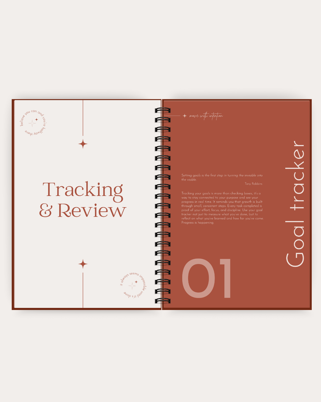 An open spiral-bound planner or notebook showing a goal tracker page with the title 'Goal tracker,' sections for 'Tracking & Review,' and the number '01' on a warm rust and cream layout.